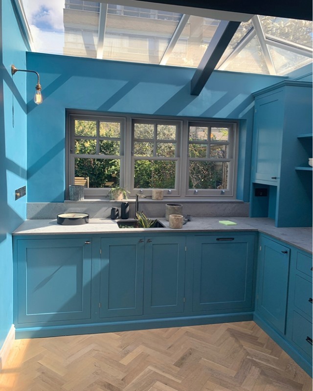 3. Twilight Blue Mosaic Backsplash with Copper Accents