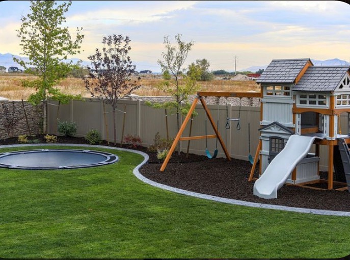 16. a Kaleidoscope Of Colorful Tires and Twirling Ropes In a Sun-drenched Backyard