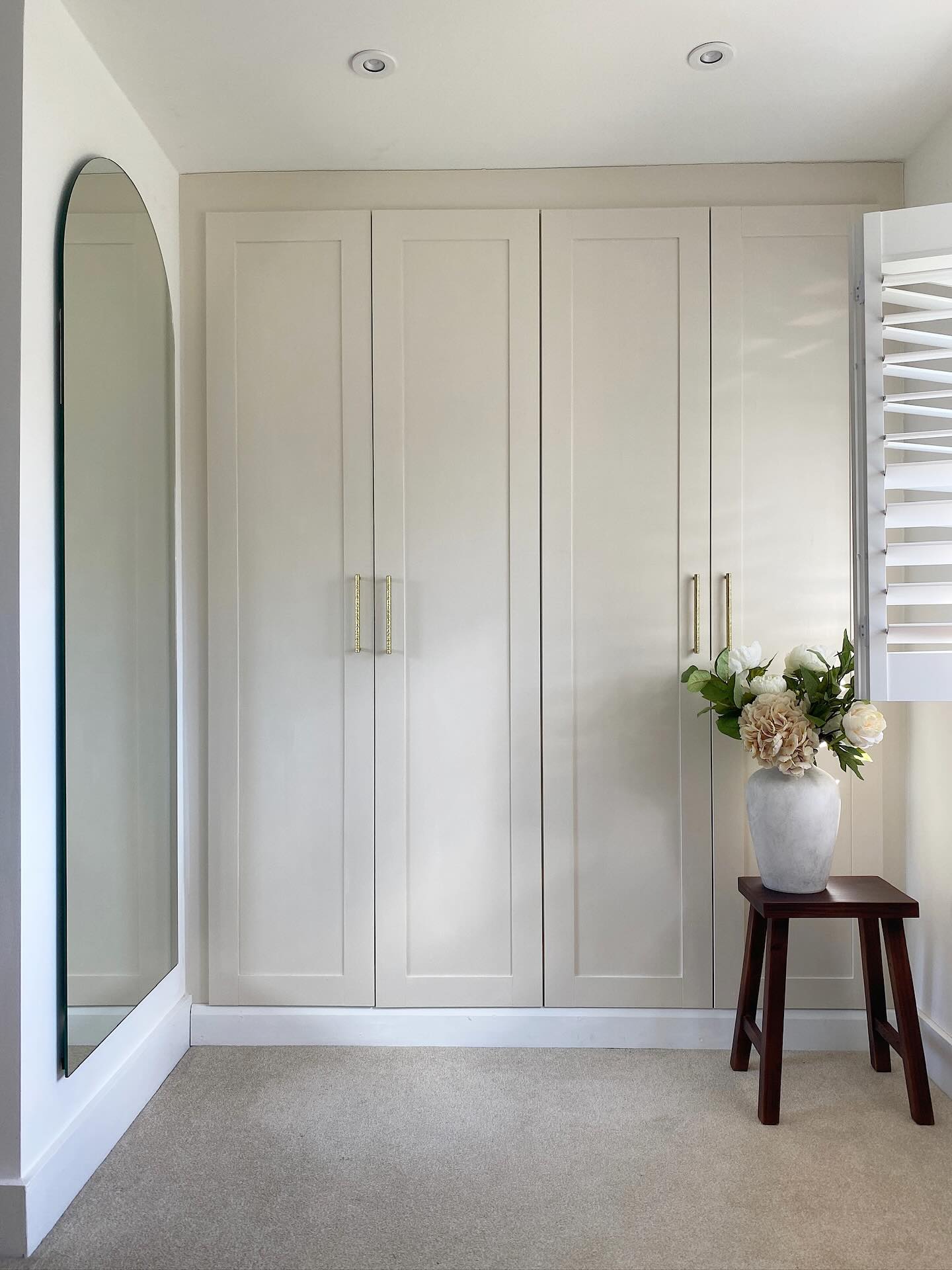 5. the Intersecting Geometric Panels and Soft Lighting Built-in Wardrobe