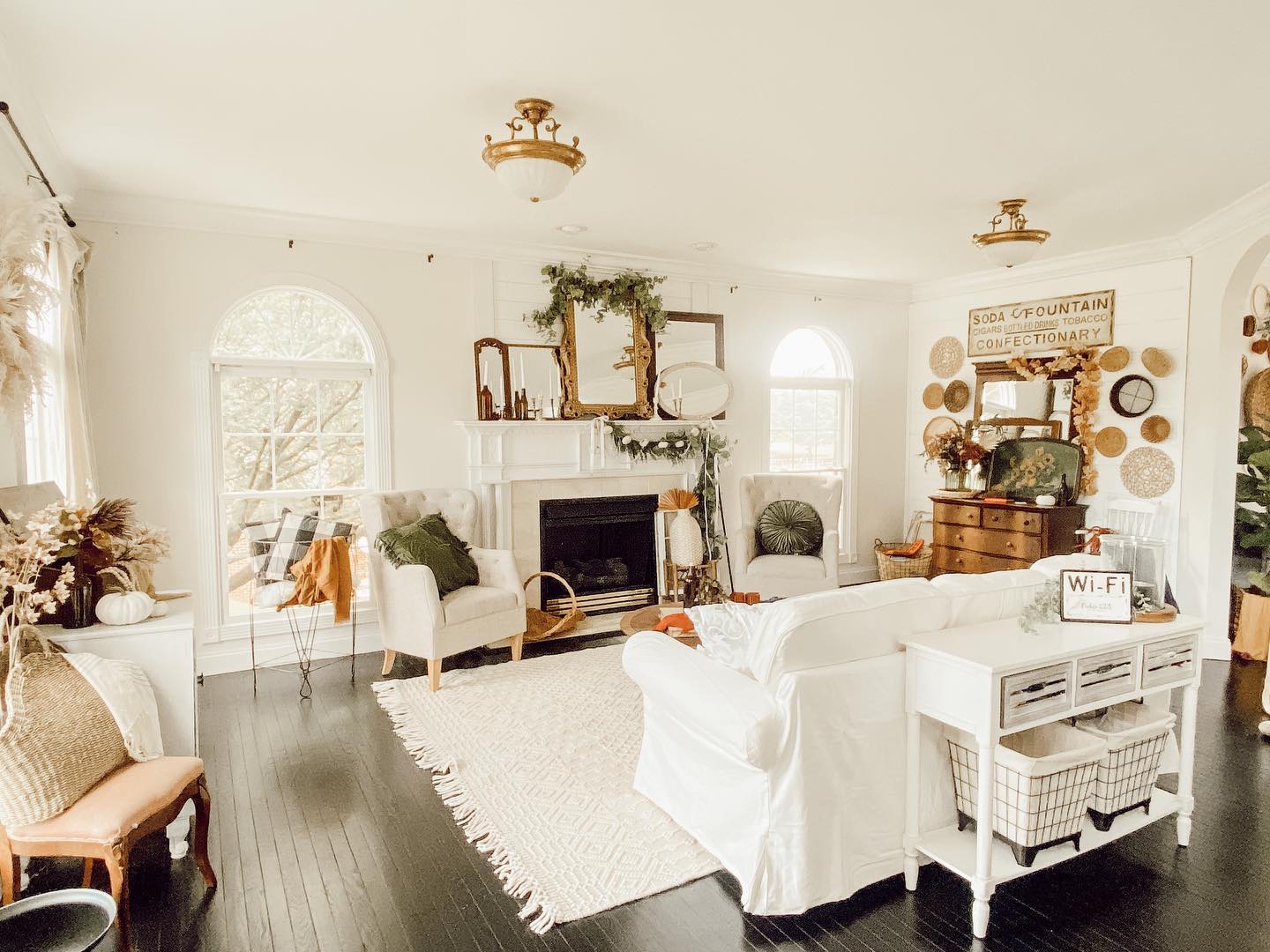 10. Cinnamon Stick Garland and White Pumpkin Ensemble on Rustic Mantel