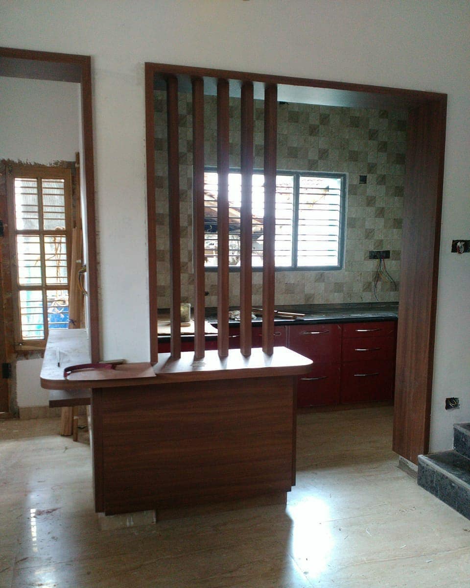 3. the Melding Of Geometric Wood Panels and Vibrant Red Accents In a Kitchen Partition