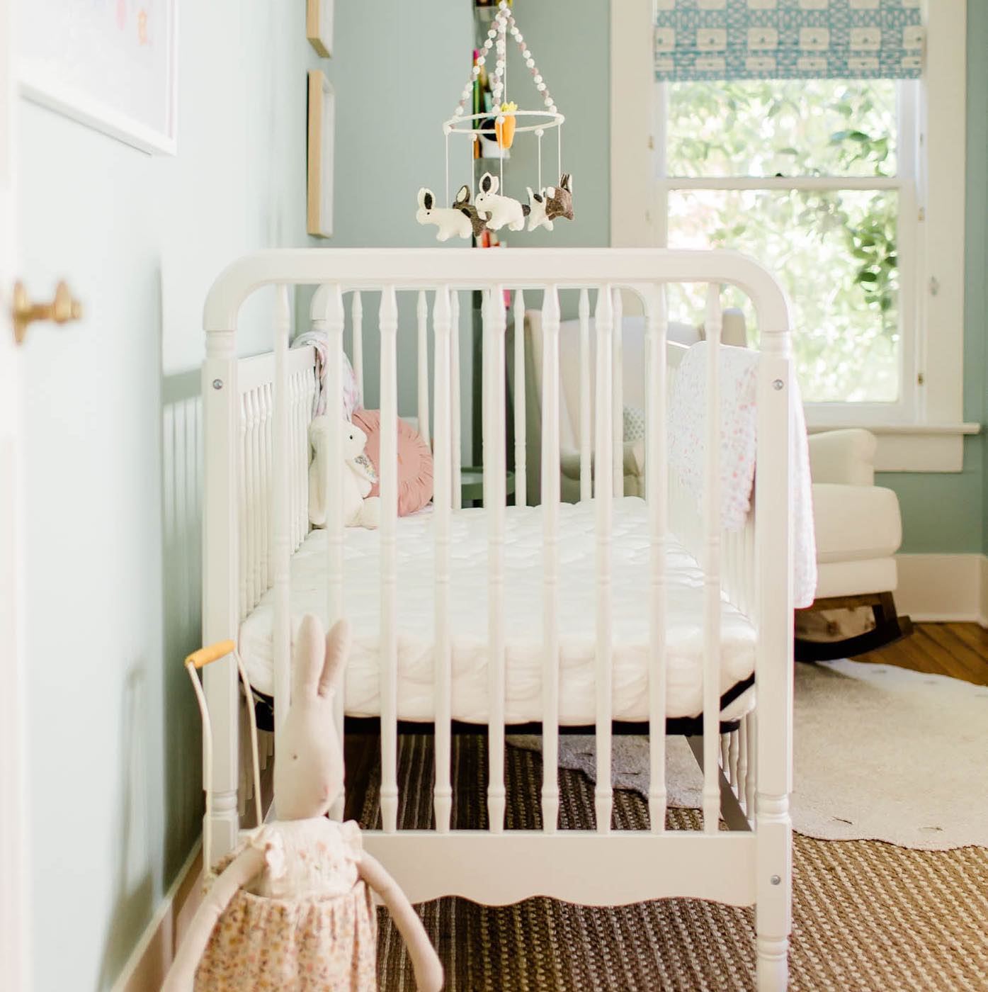 19. the Cactus-accented Teal Rocking Chair Corner with Rainbow Garland