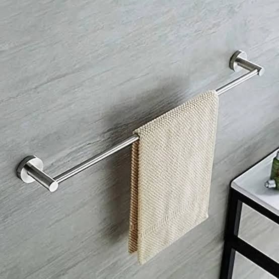 3. Moonlit Marble and Brass Elegance: a Towel Holder's Dance with Light and Shadow