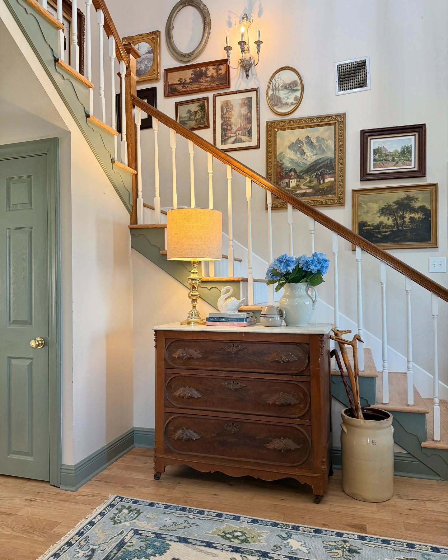 5. Velvet Wingback Chairs Flanking a Sunlit Console with Geometric Mirror