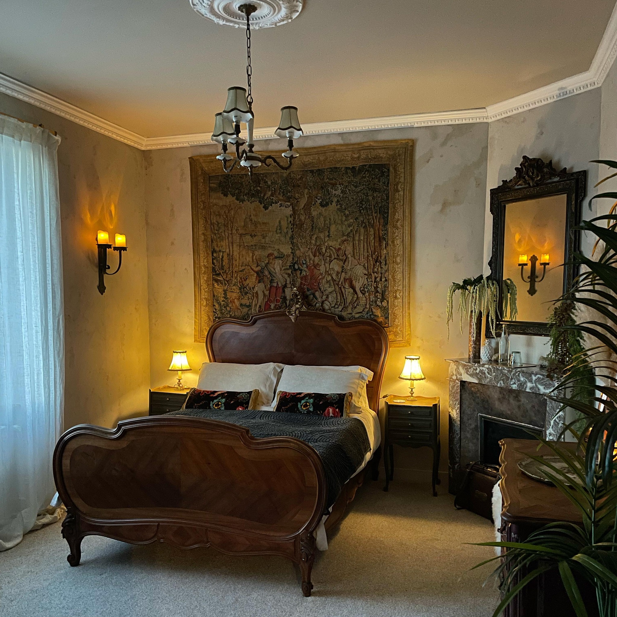 30. a Canopy Of Twigs and Moss Over a Vintage Bed with Wildflower Accents