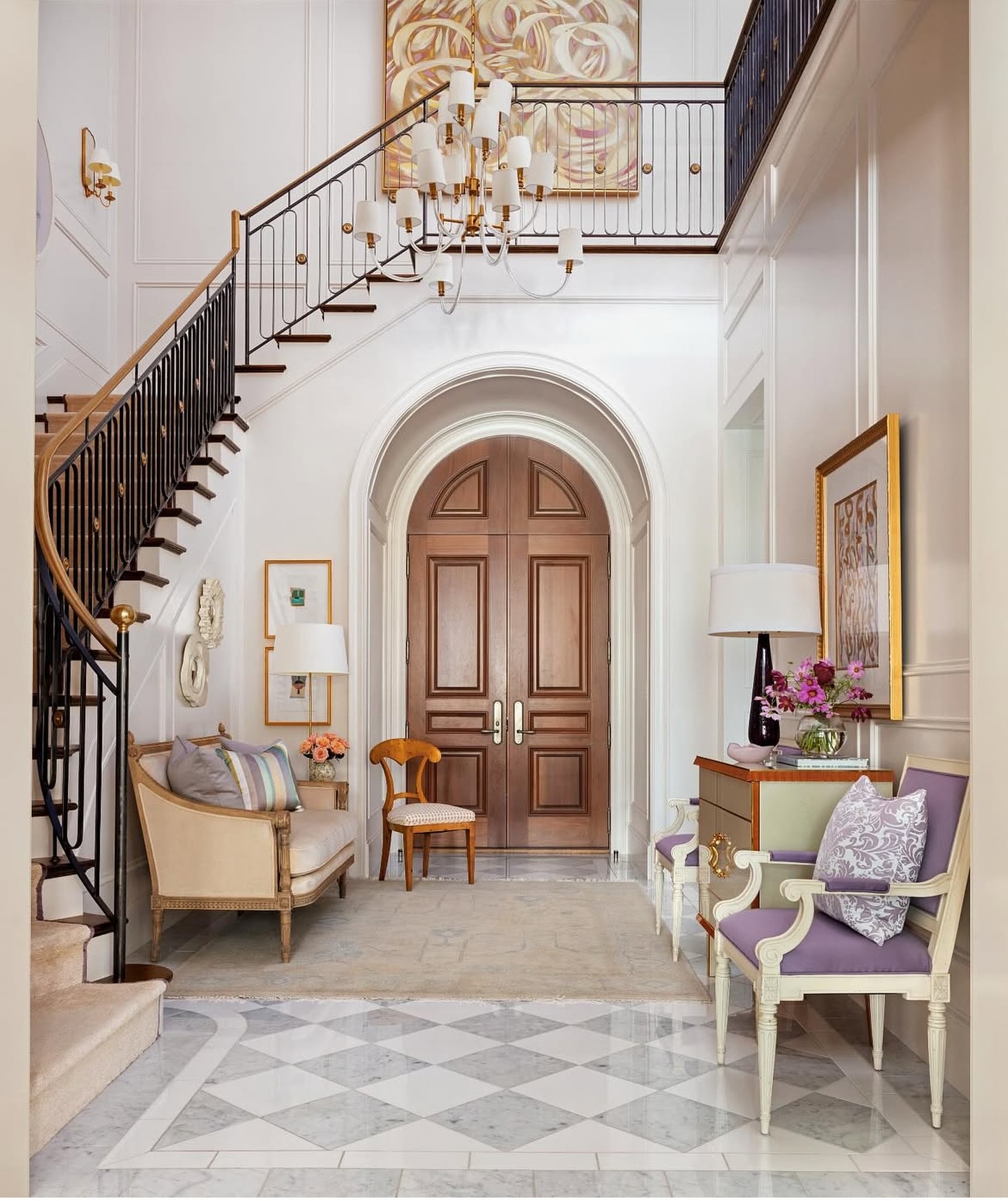 34. Cascading Crystal Chandelier Reflecting Warmth on a Vintage Console with Potted Orchids