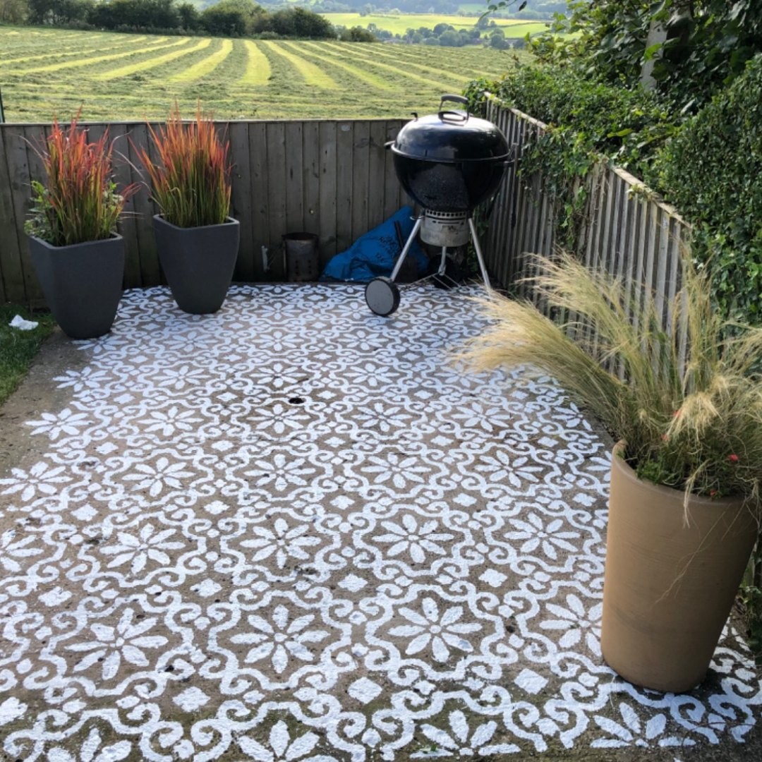 18. a Mosaic Of Terracotta Pots with a Whimsical Windmill Centerpiece