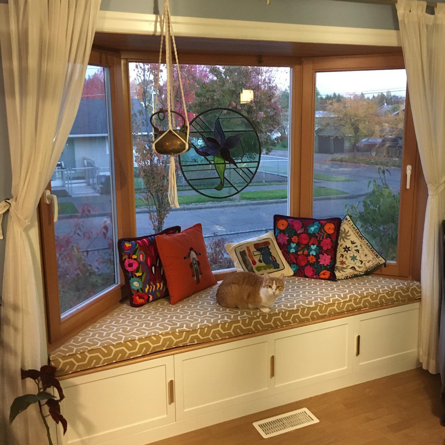 40. Bay Window Oasis with Verdant Foliage and Vintage Charm