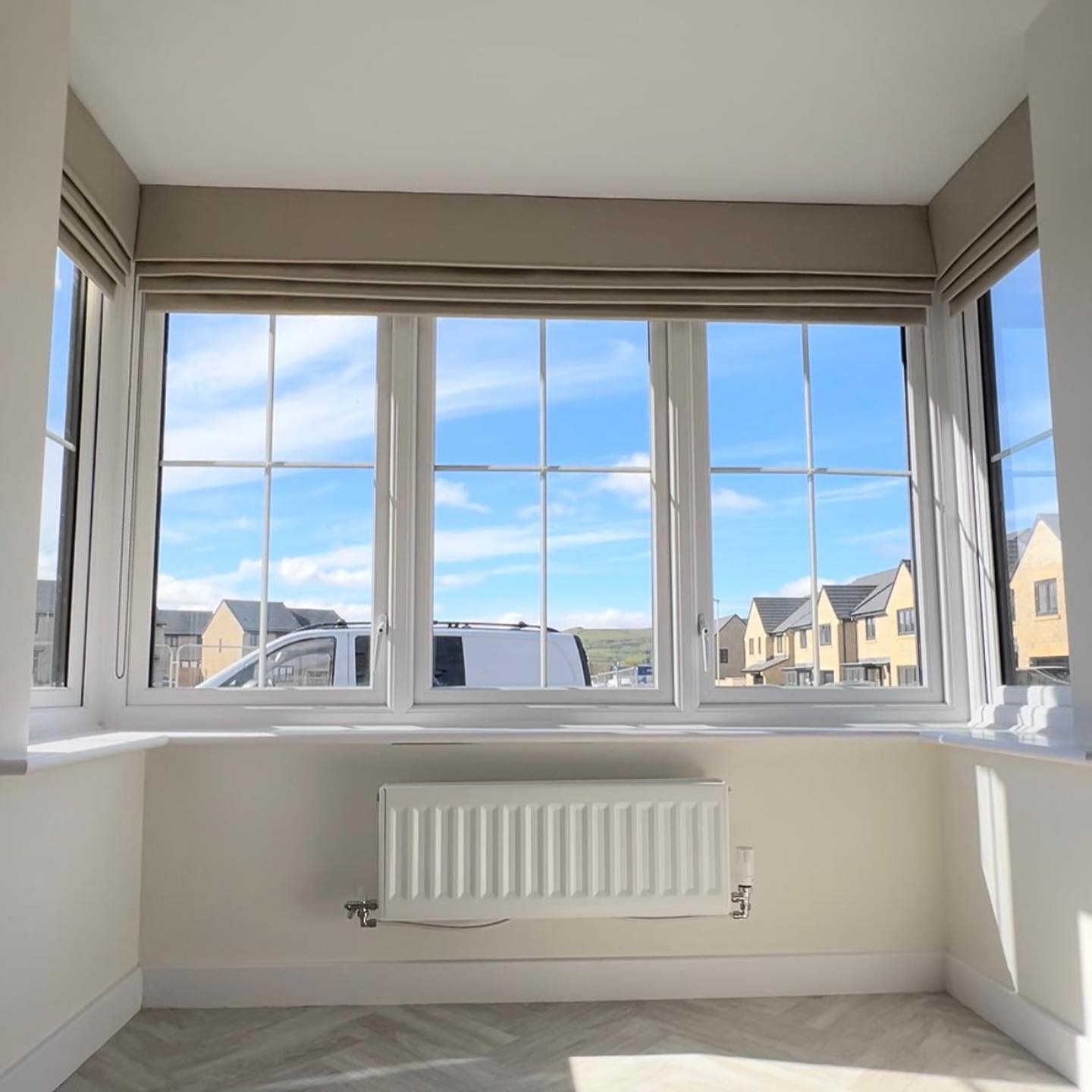 3. a Sunlit Sonata Of Striped Pillows and Potted Plants on a Bay Window Ledge