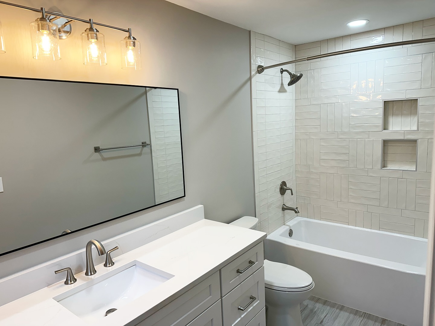 1. the Mosaic Tile Accent Wall with Floating Shelves and Vintage Mirror