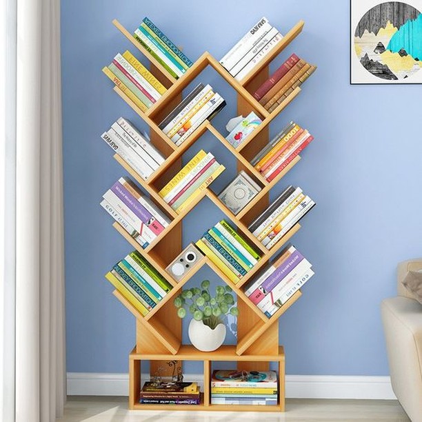 13. a Cascade Of Literature: Books Arranged In a Waterfall Effect Over a White Console