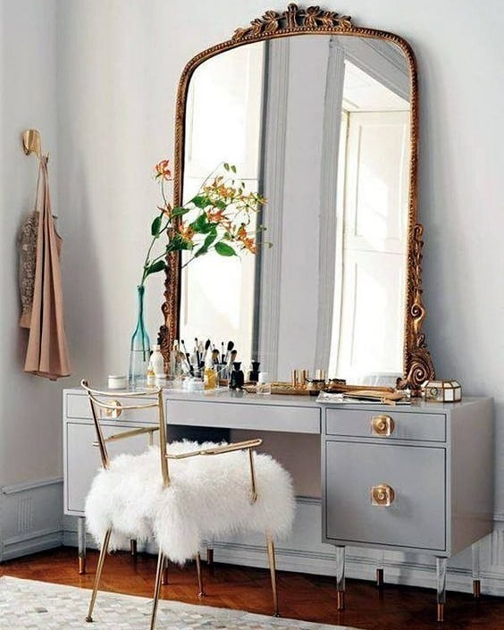 1. Moonlit Elegance: Crescent-shaped Mirror Over Distressed Wood Vanity