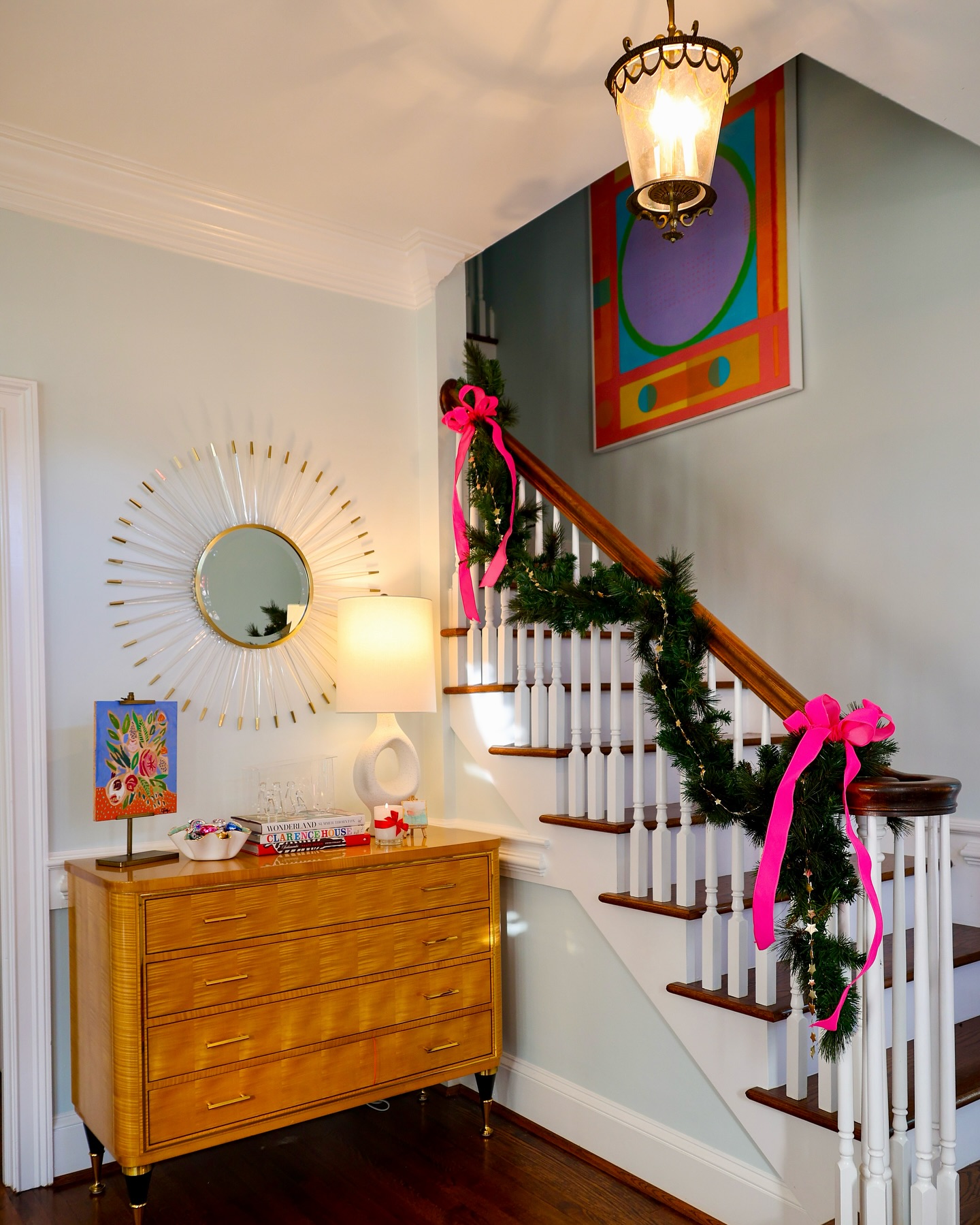 11. Cascading Ferns and Geometric Mirrors In a Sunlit Foyer